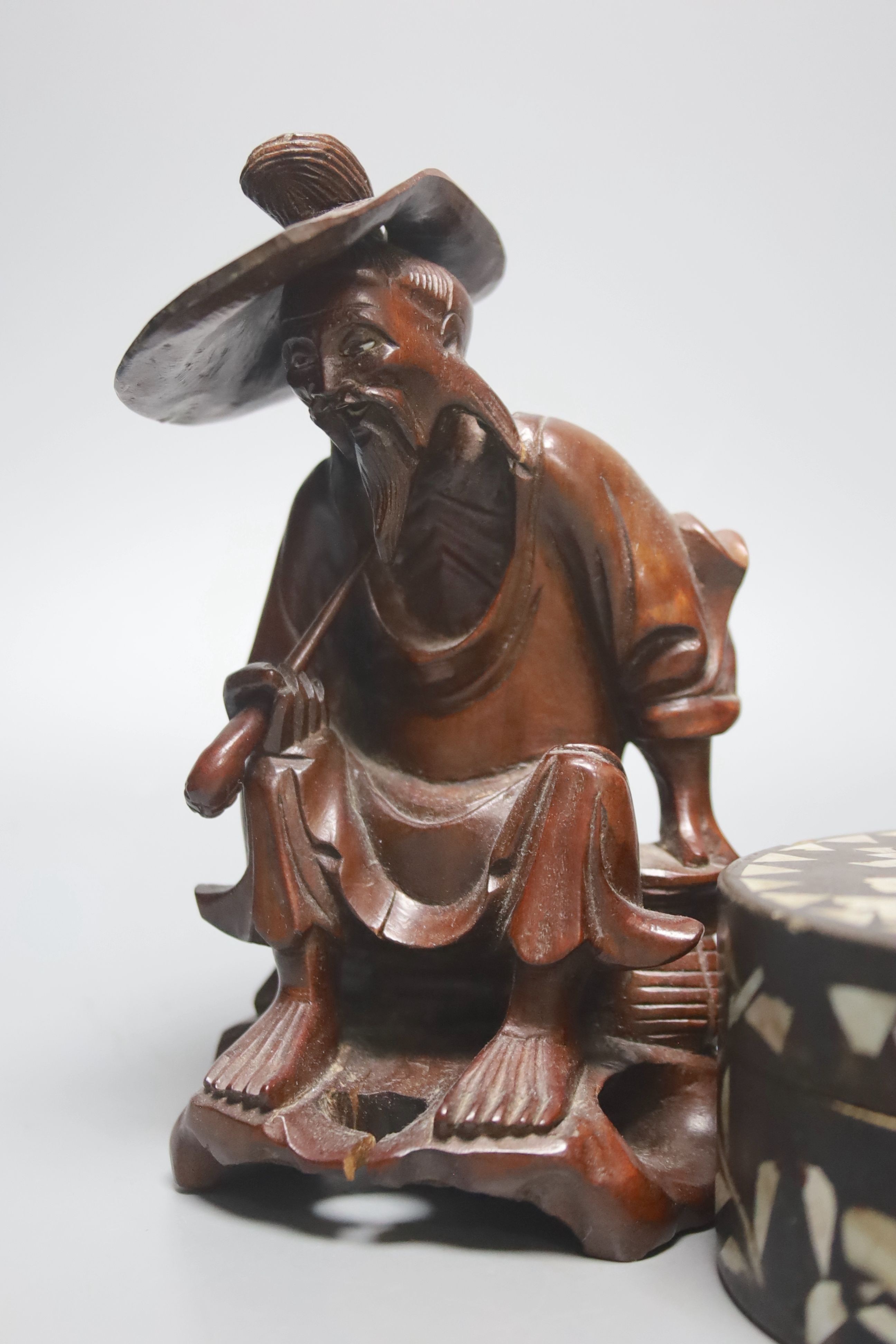 Four Chinese carved wood figures and a box, 18 cms high.